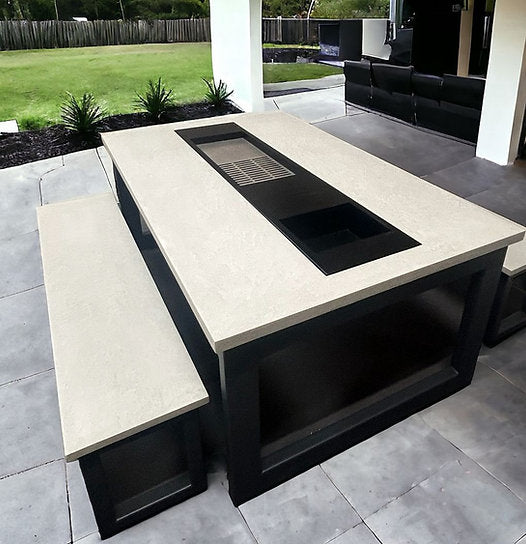 Outdoor kitchen island with seating area on a patio