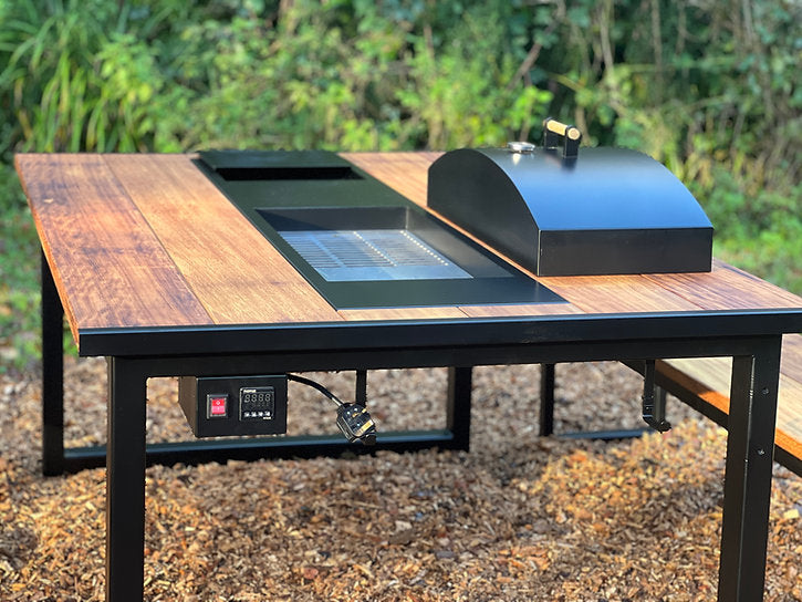 Wooden table with electronic device on a natural background
