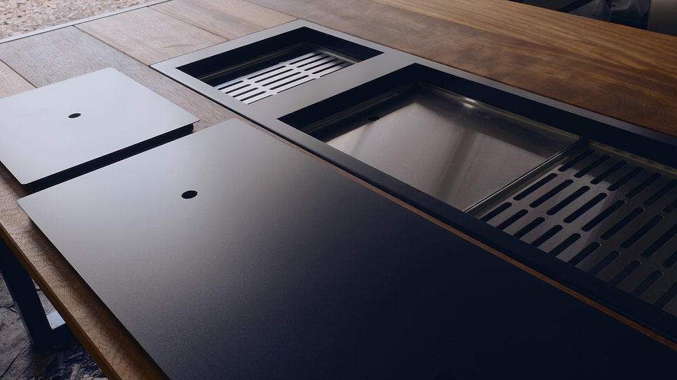 Stainless steel kitchen sink with wooden countertop