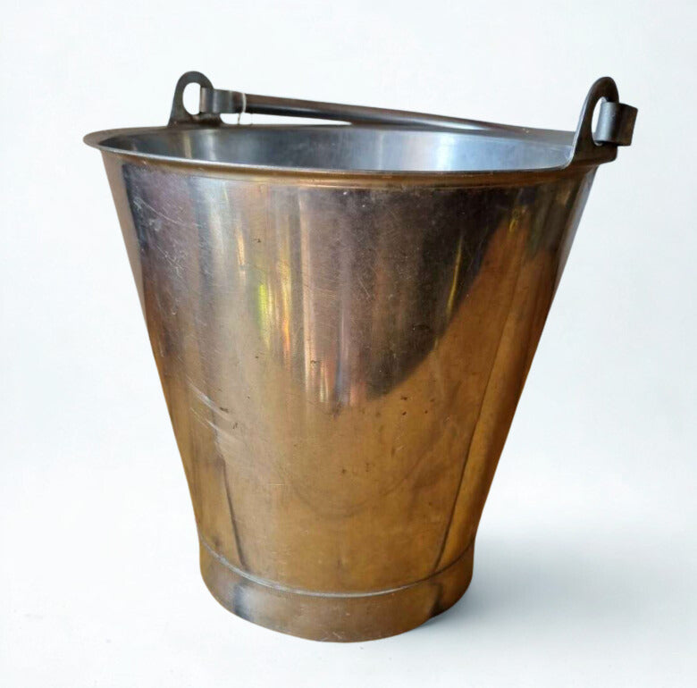 Metal bucket with a handle on a white background