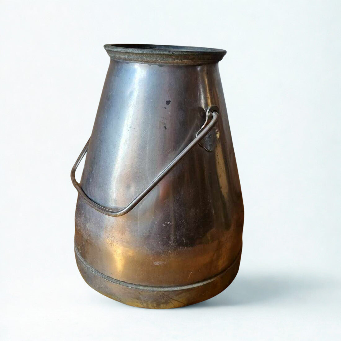Vintage metal milk churn on a white background